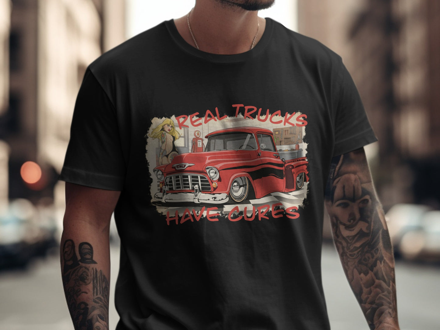 Black t-shirt with "Real Trucks Have Cures" text and vintage red truck graphic.