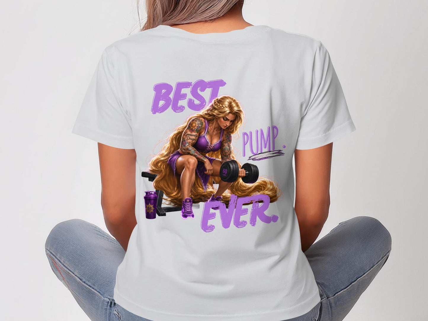 Woman in white t-shirt with "BEST PUMP EVER" text and tattooed character lifting dumbbell.