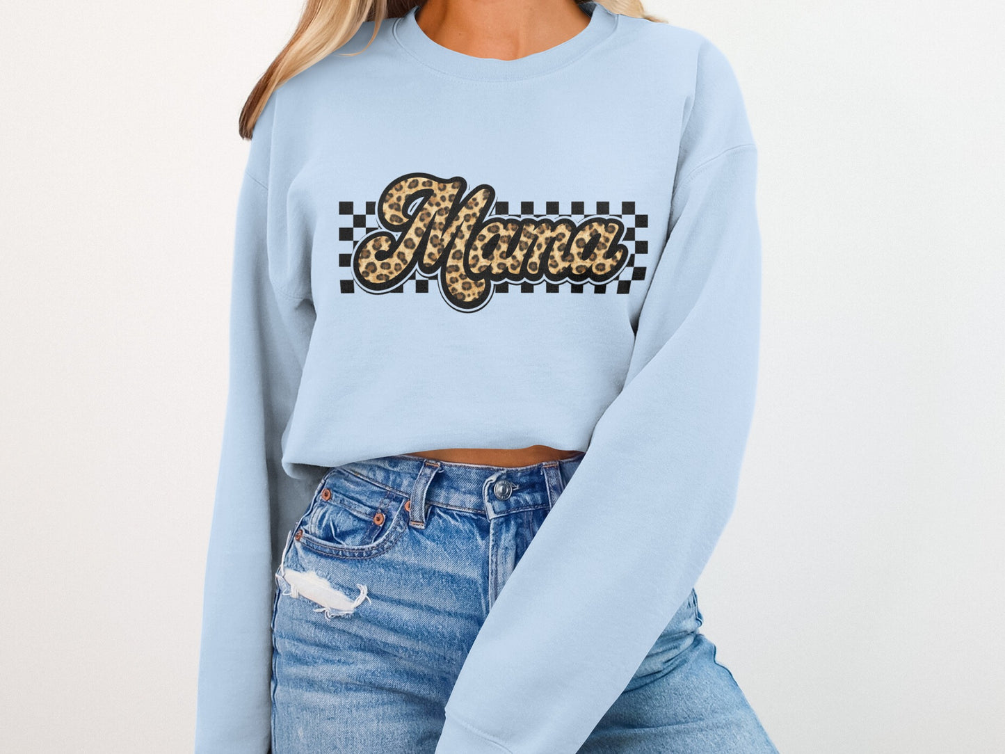 Light blue sweatshirt with "Mama" text in leopard print and checkered border.