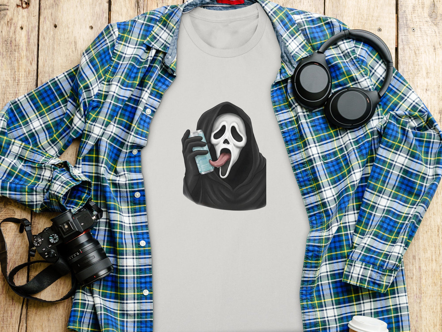 Ghostface mask and Scream movie graphic on a white t-shirt.